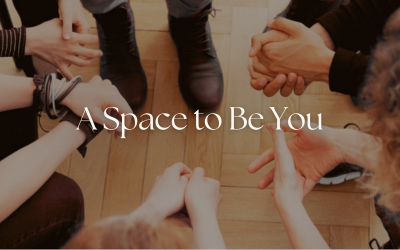 A Group of People's Hand's in a Supportive Circle